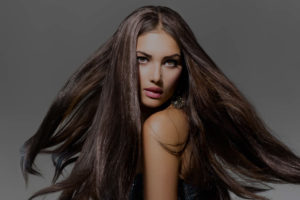 Woman with long, flowing brown hair.