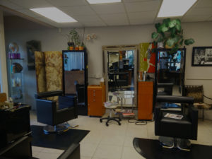 Modern hair salon with styling chairs.