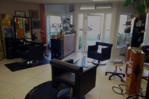 Modern hair salon with stylish chairs.